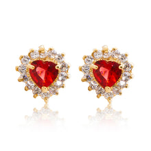 Load image into Gallery viewer, A beautiful tribute to the heart. Delicate 18ct yellow gold plated studs with clear cubic zirconia stones framing a subtle red heart at the centre.
