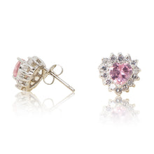 Load image into Gallery viewer, A beautiful tribute to the heart. Delicate rhodium plated studs with clear cubic zirconia stones framing a subtle pink heart stone at the centre. For pierced ears. Side view (Butterfly and pole closure)

