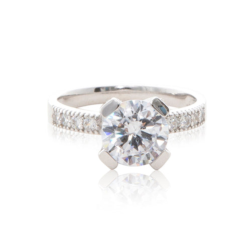 A dazzling 925 sterling silver round brilliant claw set CZ solitaire engagement ring style CZ half band ring.