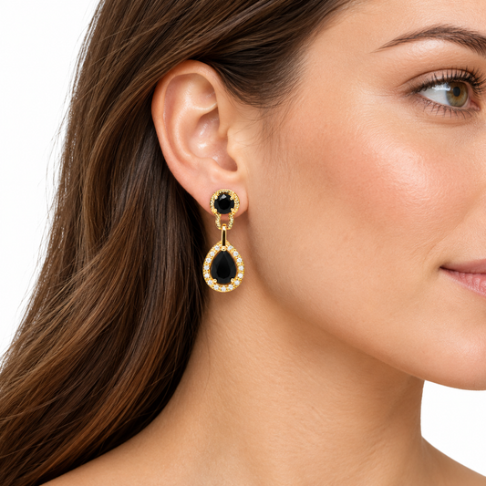 Nicole gold and black drop earring worn on a model