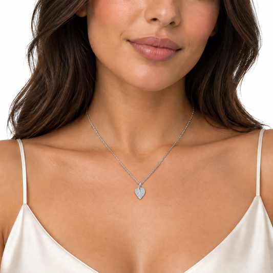 Lira sterling silver leaf necklace worn on a model