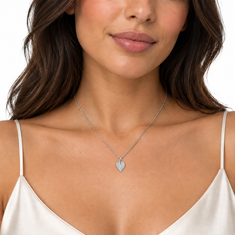 Lira sterling silver leaf necklace worn on a model