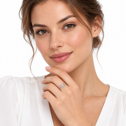 Model wearing the delicate Nessa butterfly ring on a white background