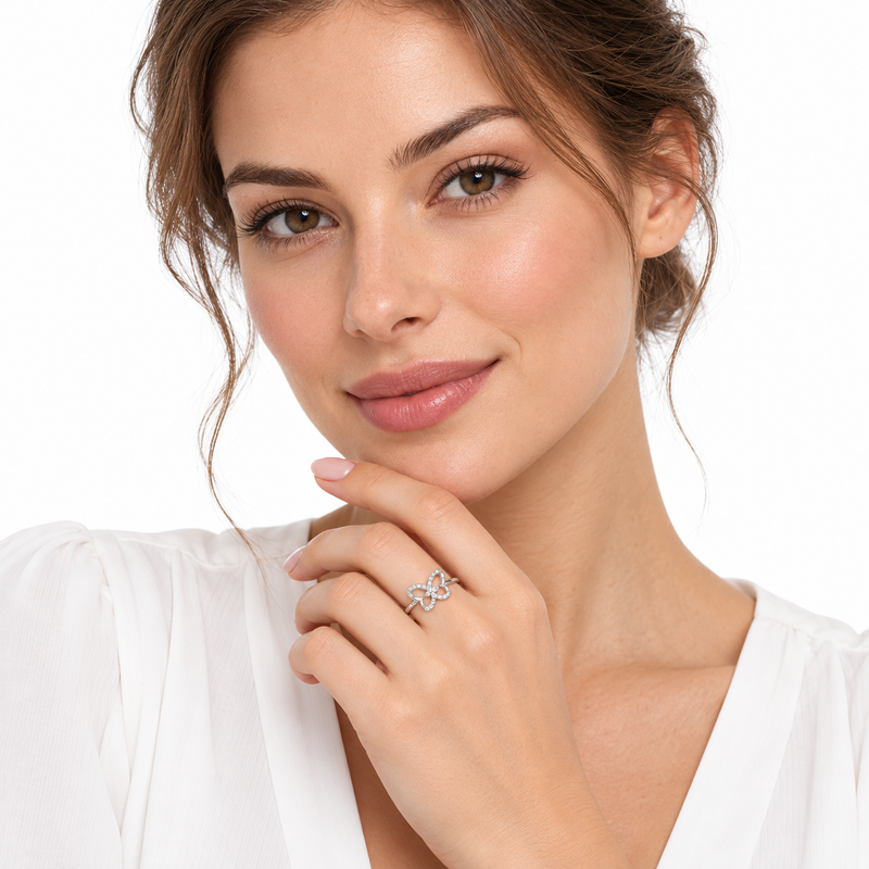 Model wearing the delicate Nessa butterfly ring on a white background