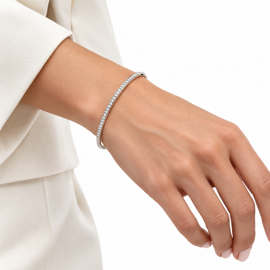 Sanem silver bangle worn on a model's wrist