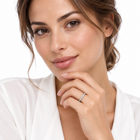 Model wearing the delicate Sasa bamboo ring on a crisp white background