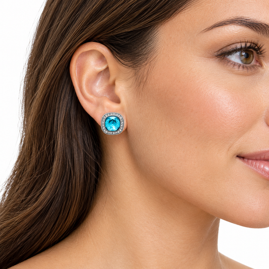 Model wearing Afina blue cushion clip-on earrings