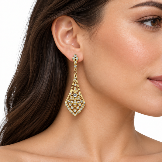 Model wearing Anastasia gold filigree drop earrings