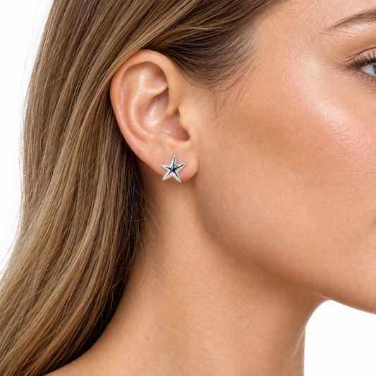 Model wearing Celeste silver starfish stud earrings
