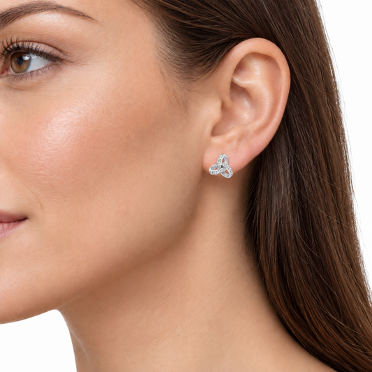 Model wearing Keily sterling silver trilogy stud earrings
