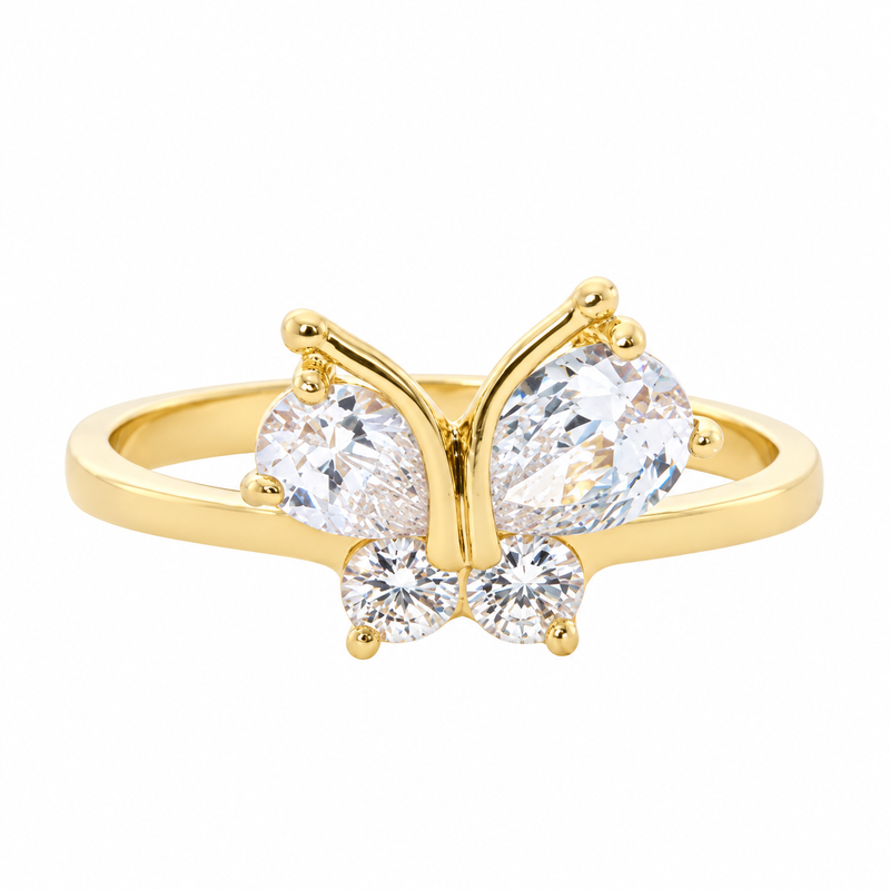 Leigh gold butterfly ring with two pear-shaped and two round clear cubic zirconia stones on a white background.