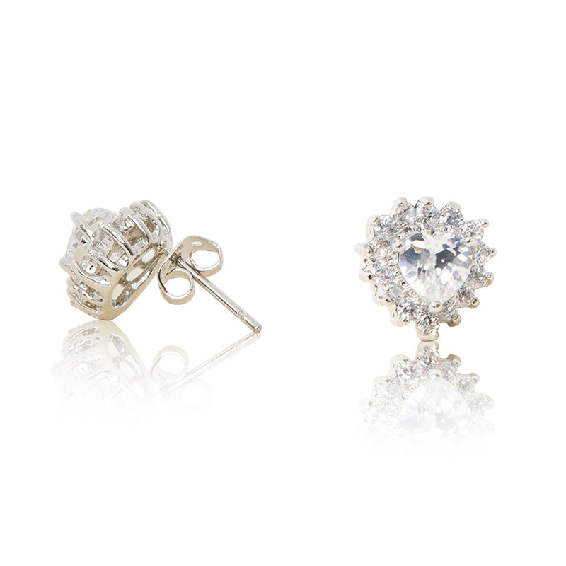 A beautiful tribute to the heart. Delicate rhodium plated studs with cubic zirconia stones framing a subtle clear heart stone at the centre. For pierced ears. Side view (Butterfly and pole closure)
