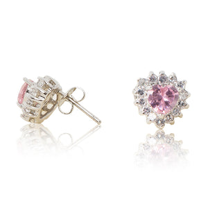 A beautiful tribute to the heart. Delicate rhodium plated studs with cubic zirconia stones framing a subtle pink heart stone at the centre. For pierced ears. Side view (Butterfly and pole closure)