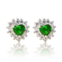 Load image into Gallery viewer, A beautiful tribute to the heart. Delicate rhodium plated studs with clear cubic zirconia stones framing a subtle green heart stone at the centre. For pierced ears.
