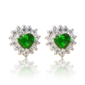 A beautiful tribute to the heart. Delicate rhodium plated studs with clear cubic zirconia stones framing a subtle green heart stone at the centre. For pierced ears.