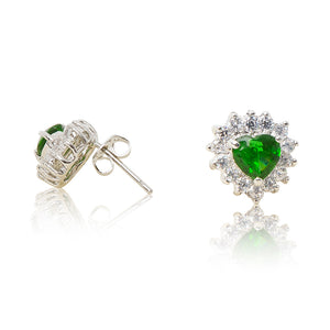 A beautiful tribute to the heart. Delicate rhodium plated studs with clear cubic zirconia stones framing a subtle green heart stone at the centre. For pierced ears. Side view (Butterfly and pole closure)