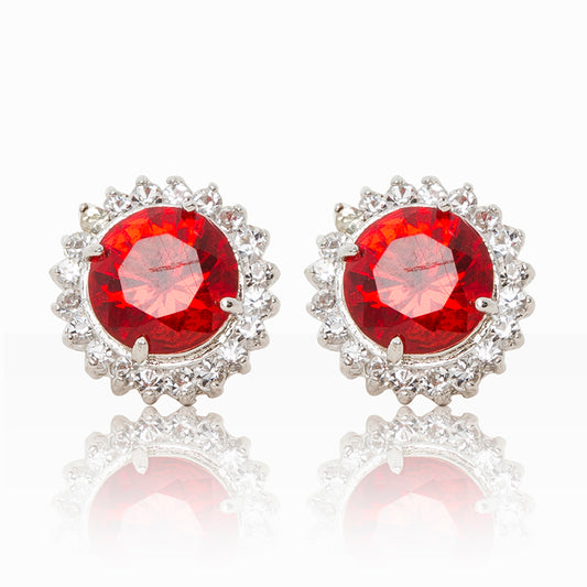Delicate rhodium plated studs with a red centre surrounded by a halo of cubic zirconia stones. For pierced ears.