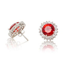 Load image into Gallery viewer, Delicate rhodium plated studs with a red centre surrounded by a halo of cubic zirconia stones. For pierced ears. Side view (Butterfly and pole closure)
