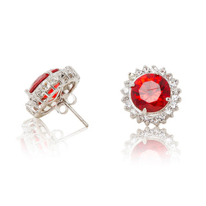 Delicate rhodium plated studs with a red centre surrounded by a halo of cubic zirconia stones. For pierced ears. Side view (Butterfly and pole closure)
