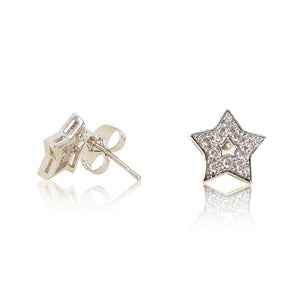 A pair of rhodium plated celestial star stud earrings set with cubic zirconia and a star centre cut out. For pierced ears. Side view (Butterfly and pole closure)
