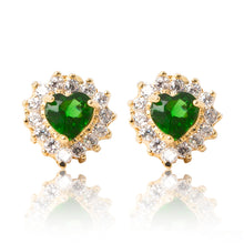 Load image into Gallery viewer, A beautiful tribute to the heart. Delicate 18ct yellow gold plated studs with clear cubic zirconia stones framing a subtle green heart at the centre. 
