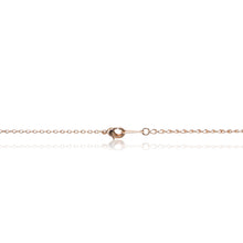 Load image into Gallery viewer, A rose gold, blood red faux ruby cushion centre stone framed in cubic zirconia pendant and chain. Trigger clasp chain closure
