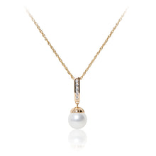 Load image into Gallery viewer, An elegant 18ct yellow gold plated cubic zirconia line drop faux pearl pendant and chain.
