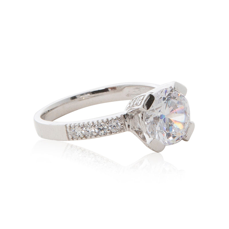 A dazzling 925 sterling silver round brilliant claw set CZ solitaire engagement ring style CZ half band ring. Side view half eternity band