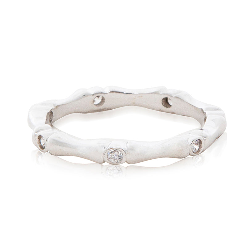 A bamboo inspired rhodium plated ring with cubic zirconia stones in a rub over setting.