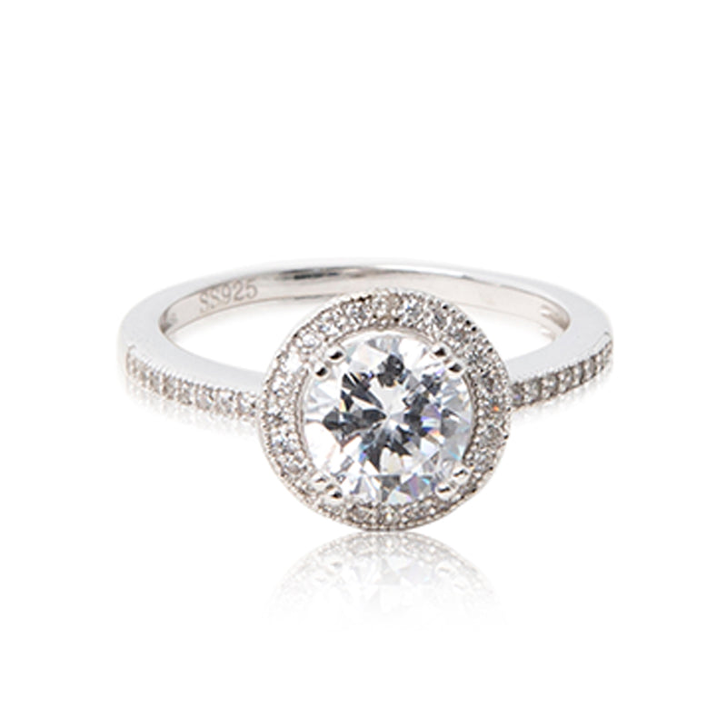 The half eternity halo band. A glamorous round brilliant cut cubic zirconia ring set in 925 sterling silver with a halo of bead-set cubic zirconia stones. Front view