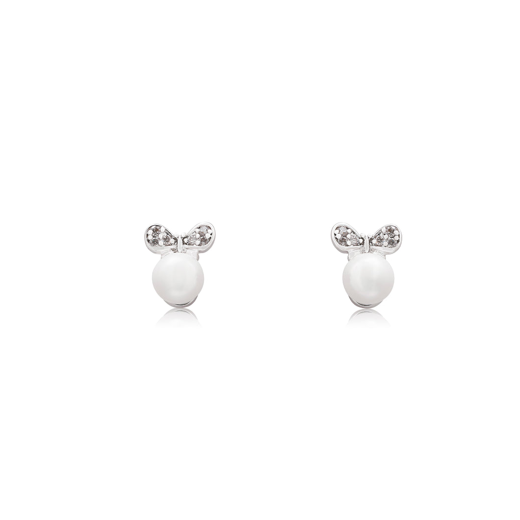 An elegant pair of stud faux pearl earrings finished with rhodium plating and cubic zirconia encrusted bows.